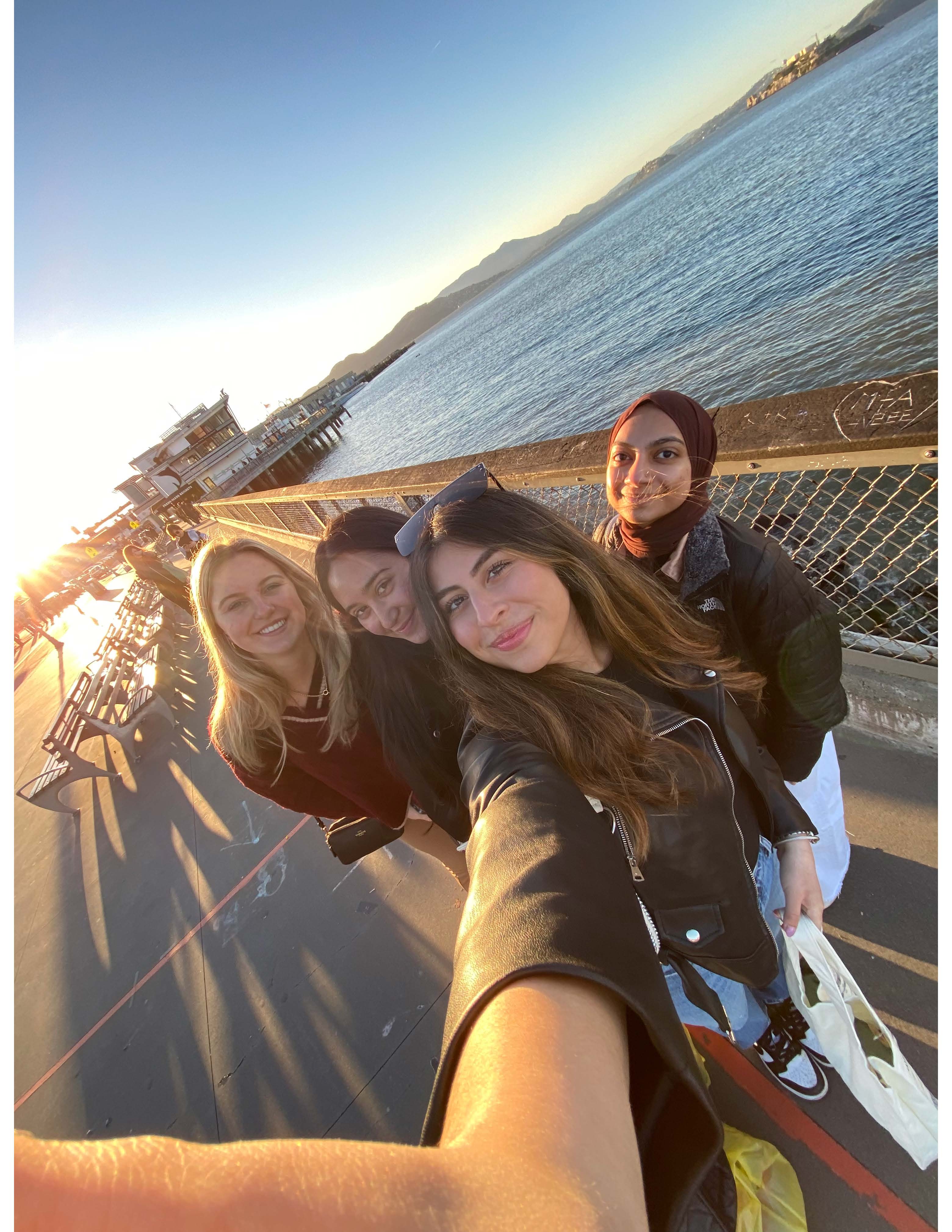 A group of business students pose for a photo at Fisherman's Wharf in San Francisco.